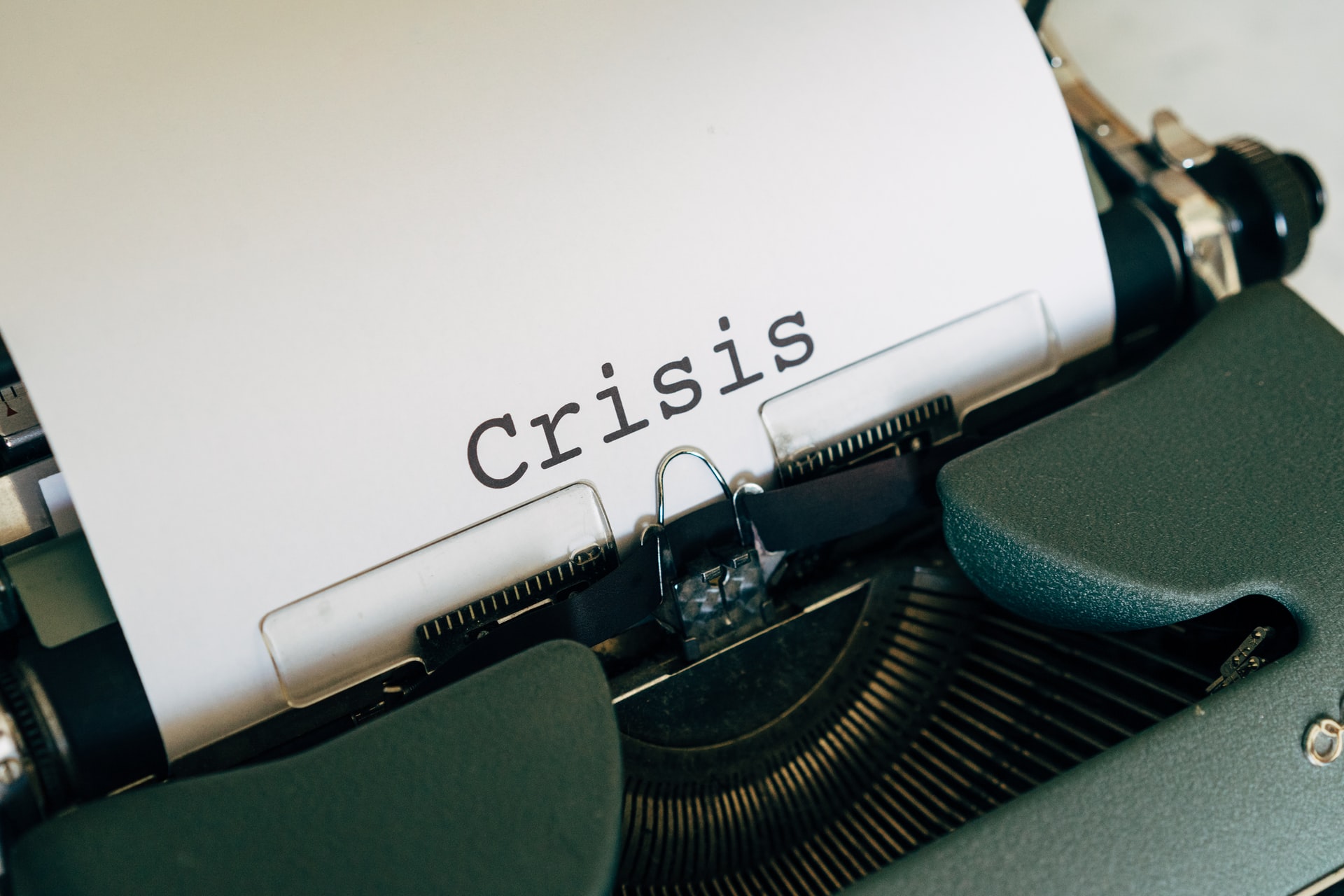 Search Reputation Net image of a typewriter that has typed the word "Crisis"